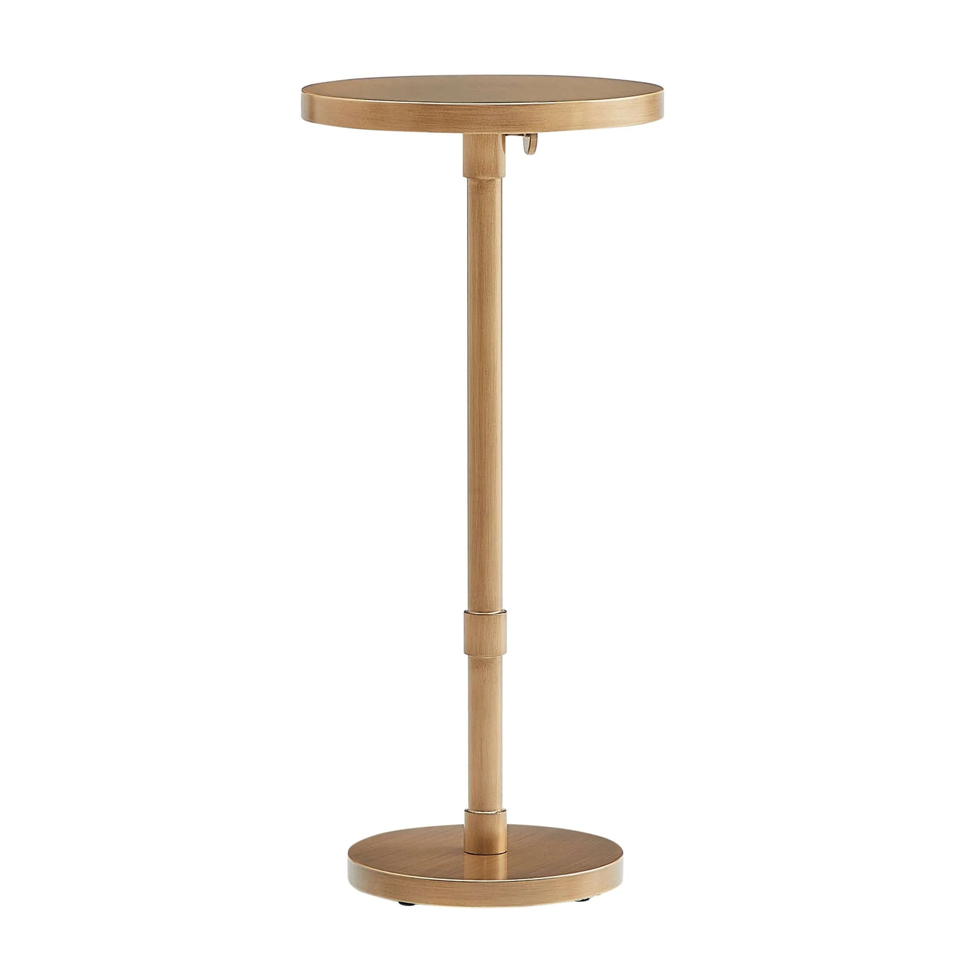 Antique brass accent table with a round top and base on a white background