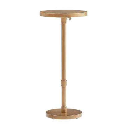 Antique brass accent table with a round top and base on a white background