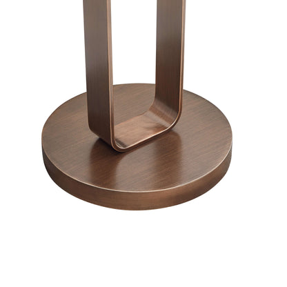 Bronze-colored metal base of a antique bronze end table on a white background