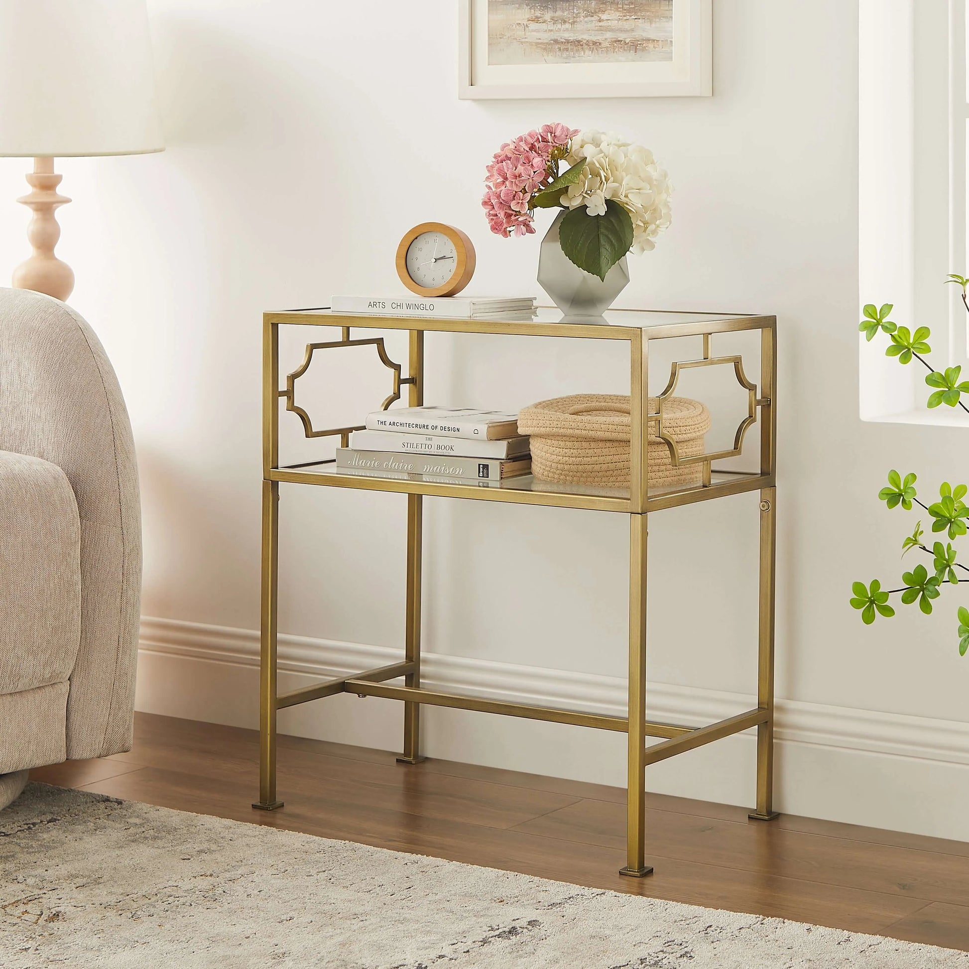 Gold accent table with decorative items in a living room setting