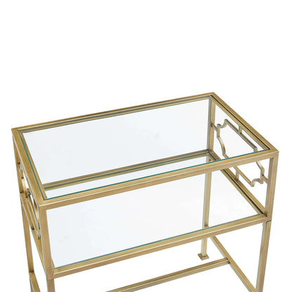 Gold-framed glass-top table on a white background