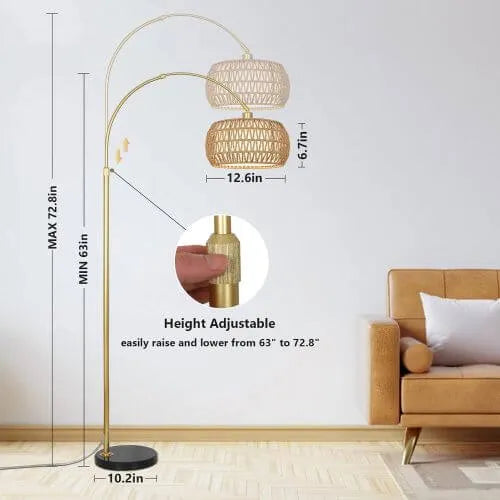 Gold floor lamp with wicker lampshades in a living room setting, showing height adjustable feature.