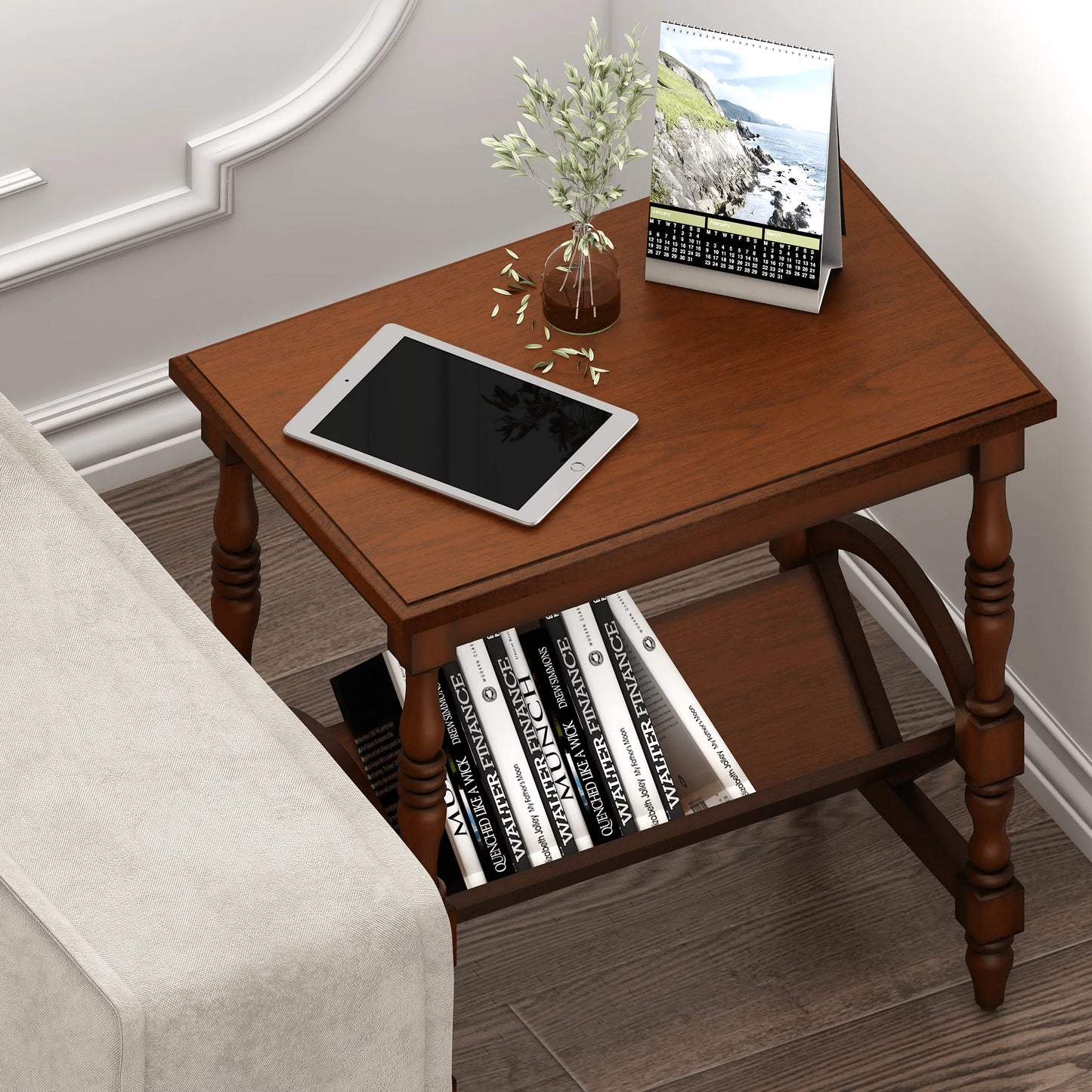 Wooden side table with books, tablet, and vase in a room setting