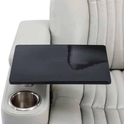 Close up of table attached to a gray leather recliner chair with cup holder on a white background.