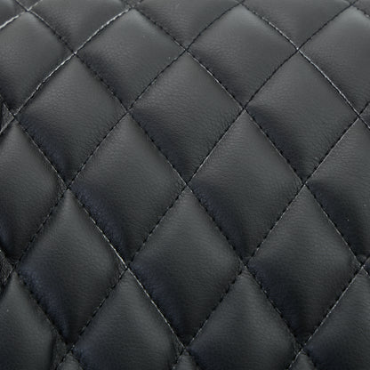 Close-up of black quilted leather texture