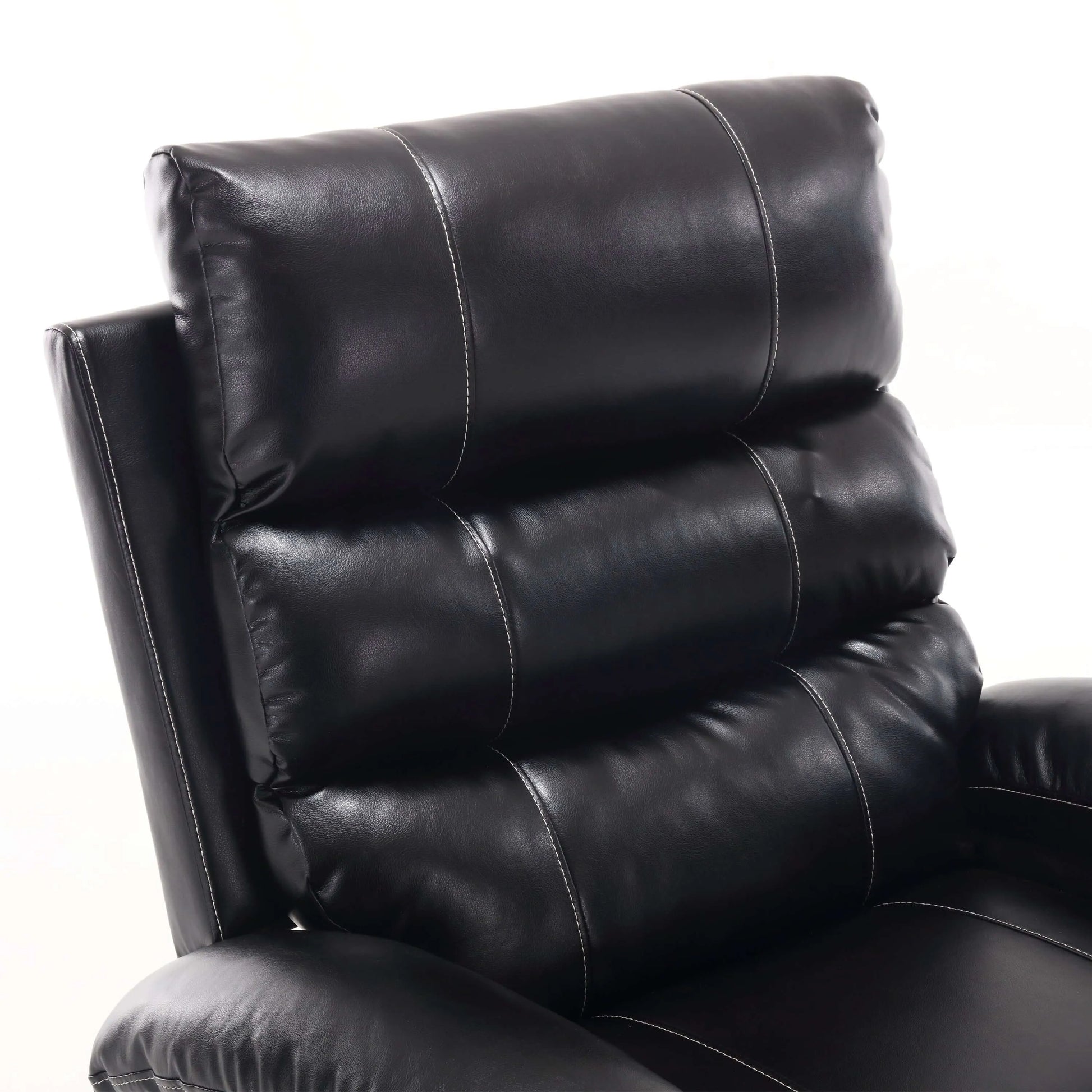 Up close view of the back cushion of a black faux leather power lift recliner chair with stitching design on a white background