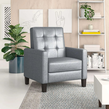 Gray recliner chair in a living room setting with a plant and bookshelf.