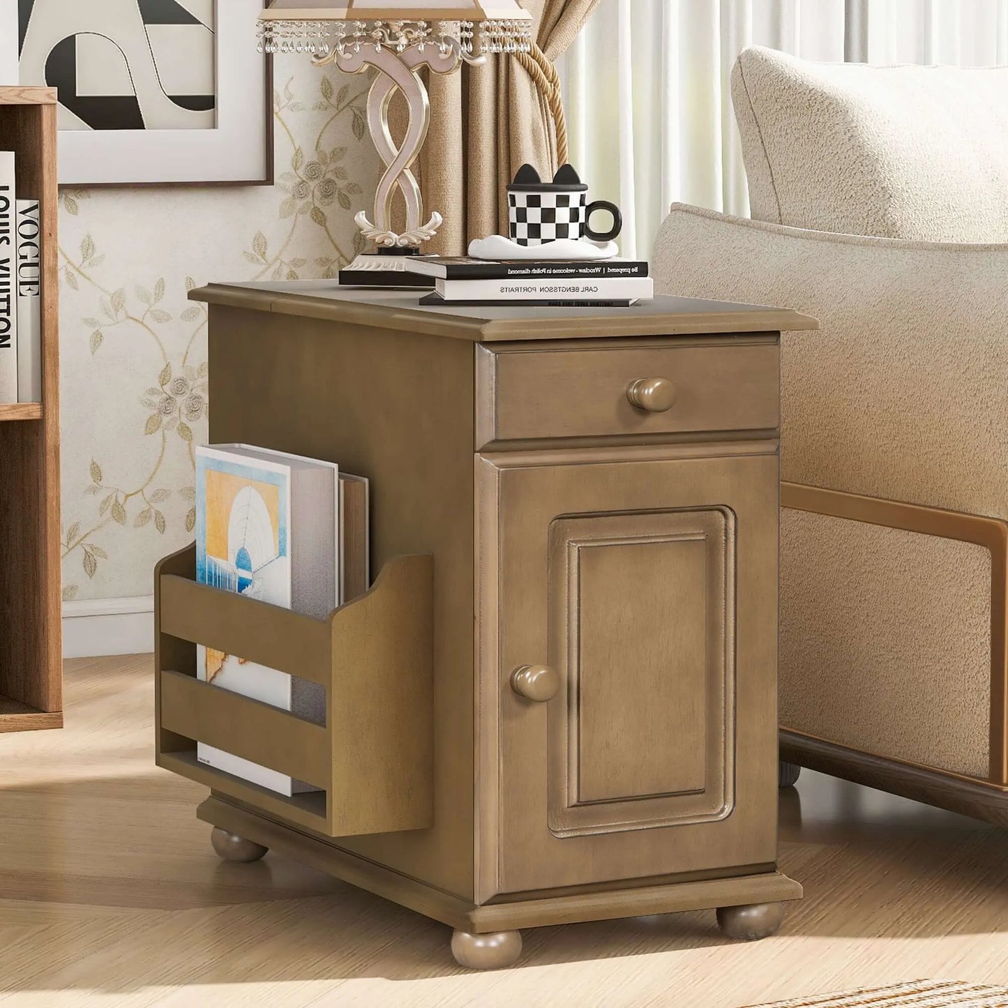 Wooden side table with a drawer and magazine holder in a living room setting.