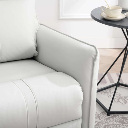 Close up of a gray recliner chair armrest in a living room setting with a small table and decor items.