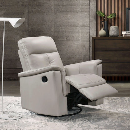 Silver recliner chair in a modern living room setting with a concrete wall and wooden dresser.