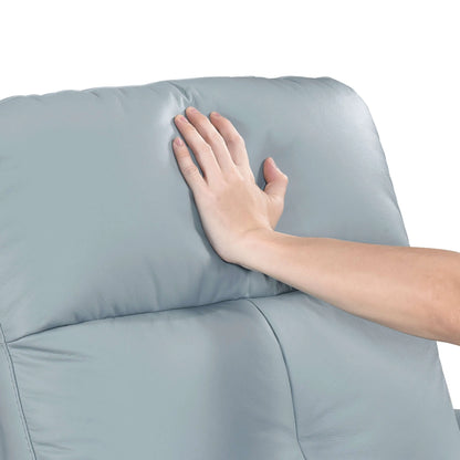 Hand touching a back cushion on a blue recliner chair with a white background