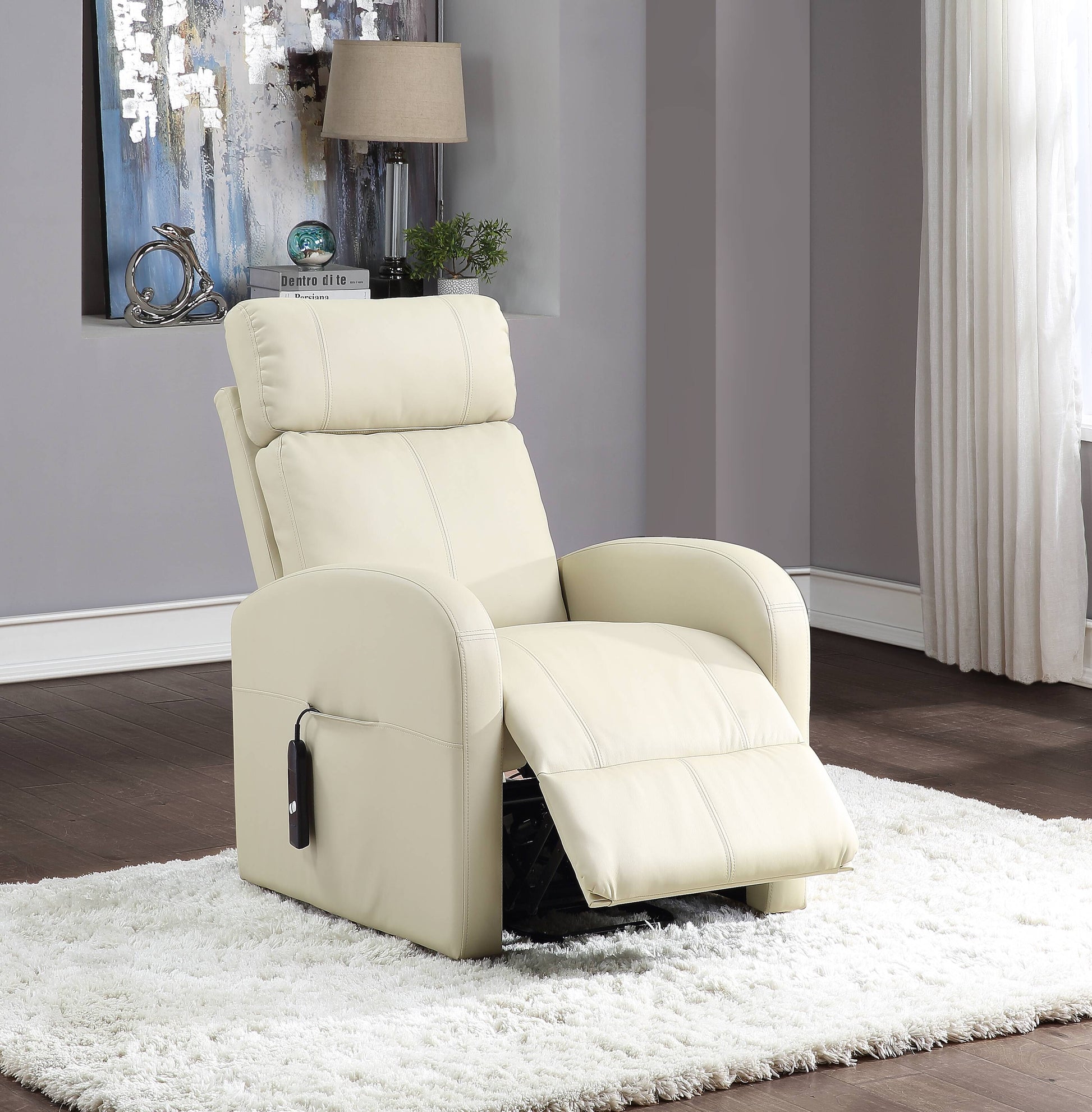 Beige recliner chair in a room with a lamp and decorative items on the wall.