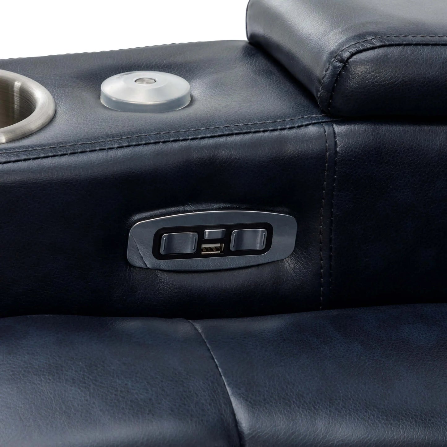 Close-up of a blue leather recliner chair control panel, cup holder and USB port.
