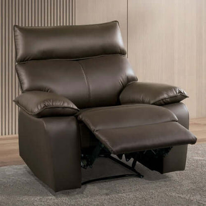 Brown faux leather recliner chair  with footrest extended in a room with wooden flooring and a neutral wall.