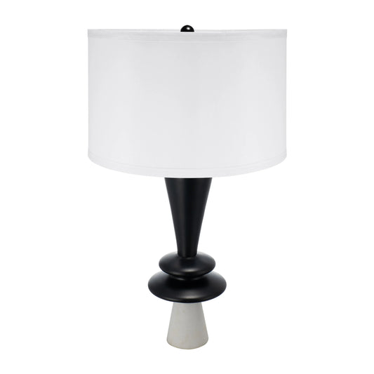 Table lamp with black base and white shade on a white background