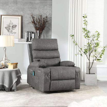 Gray faux leather power lift recliner chair in living room setting with table, lamp and plant