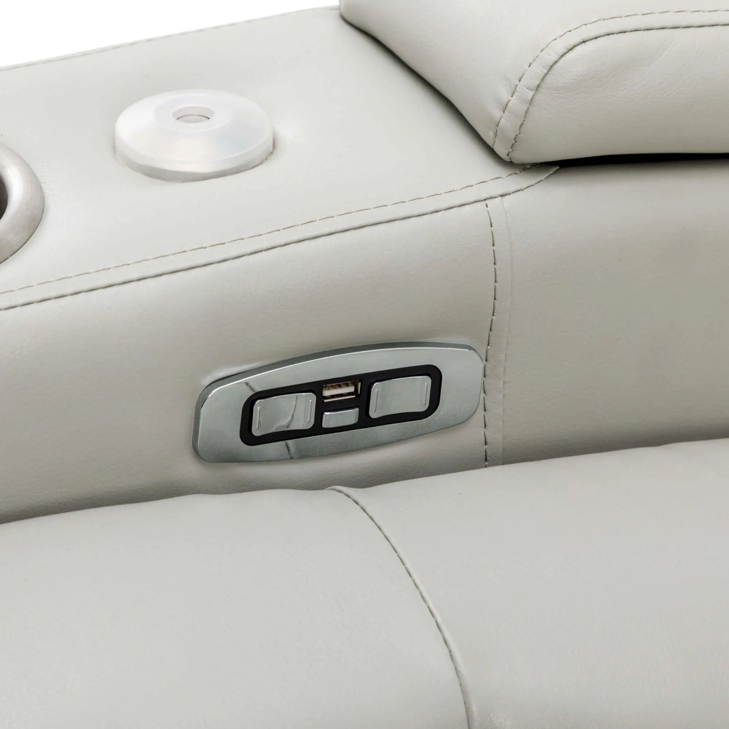 Close-up of a control panel on a gray leather recliner chair