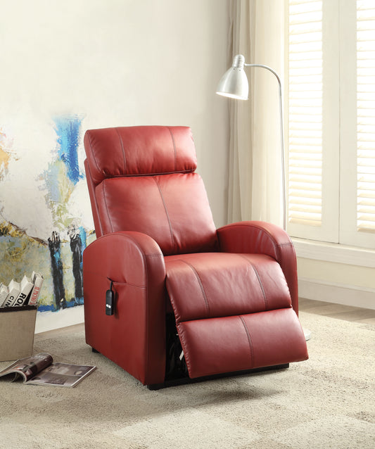 Red leather recliner chair in a living room setting with a lamp and artwork in the background.