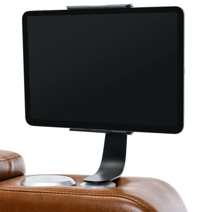 Tablet holder on a brown leather recliner chair on a white background