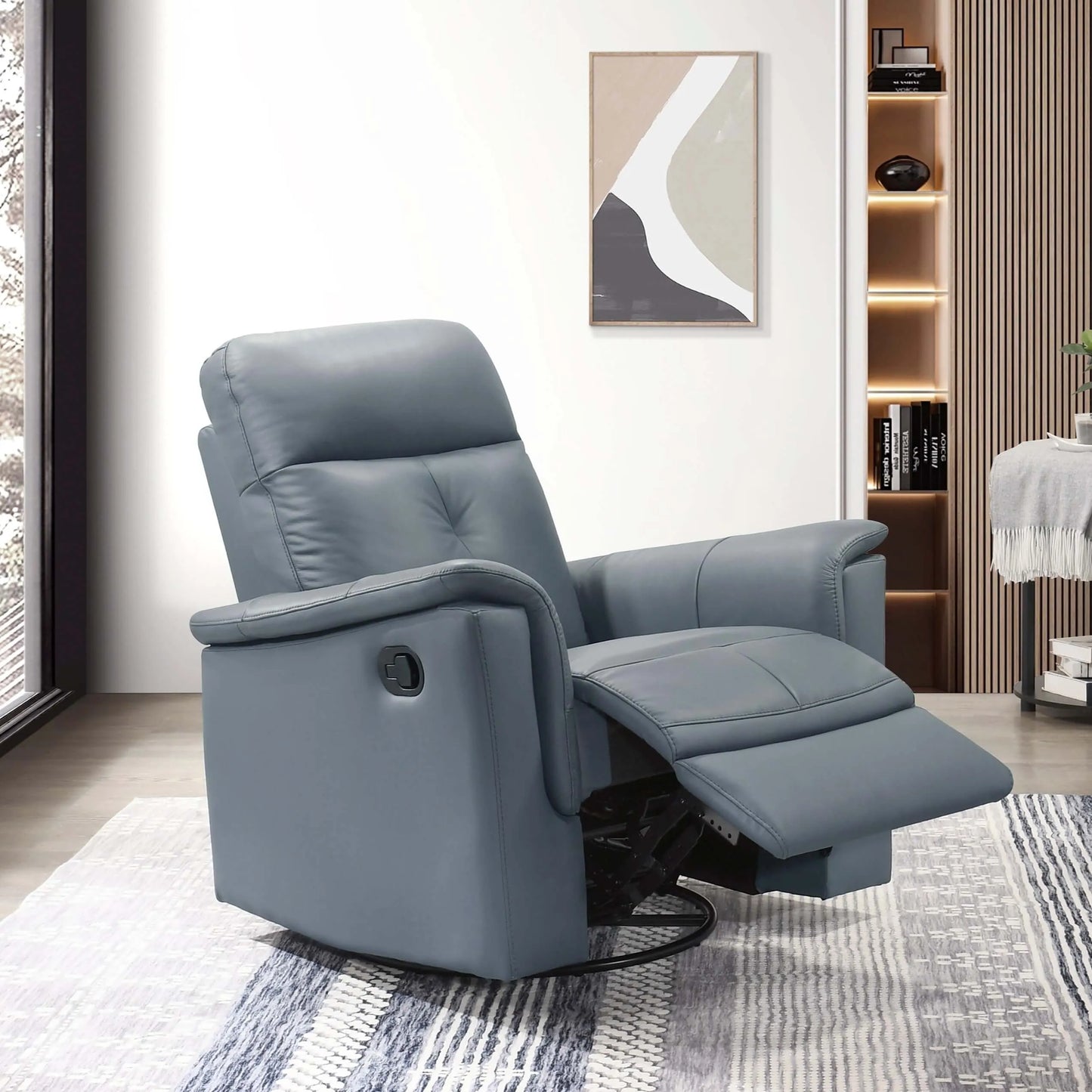 Blue gray recliner chair in a living room setting with a rug and wall art.
