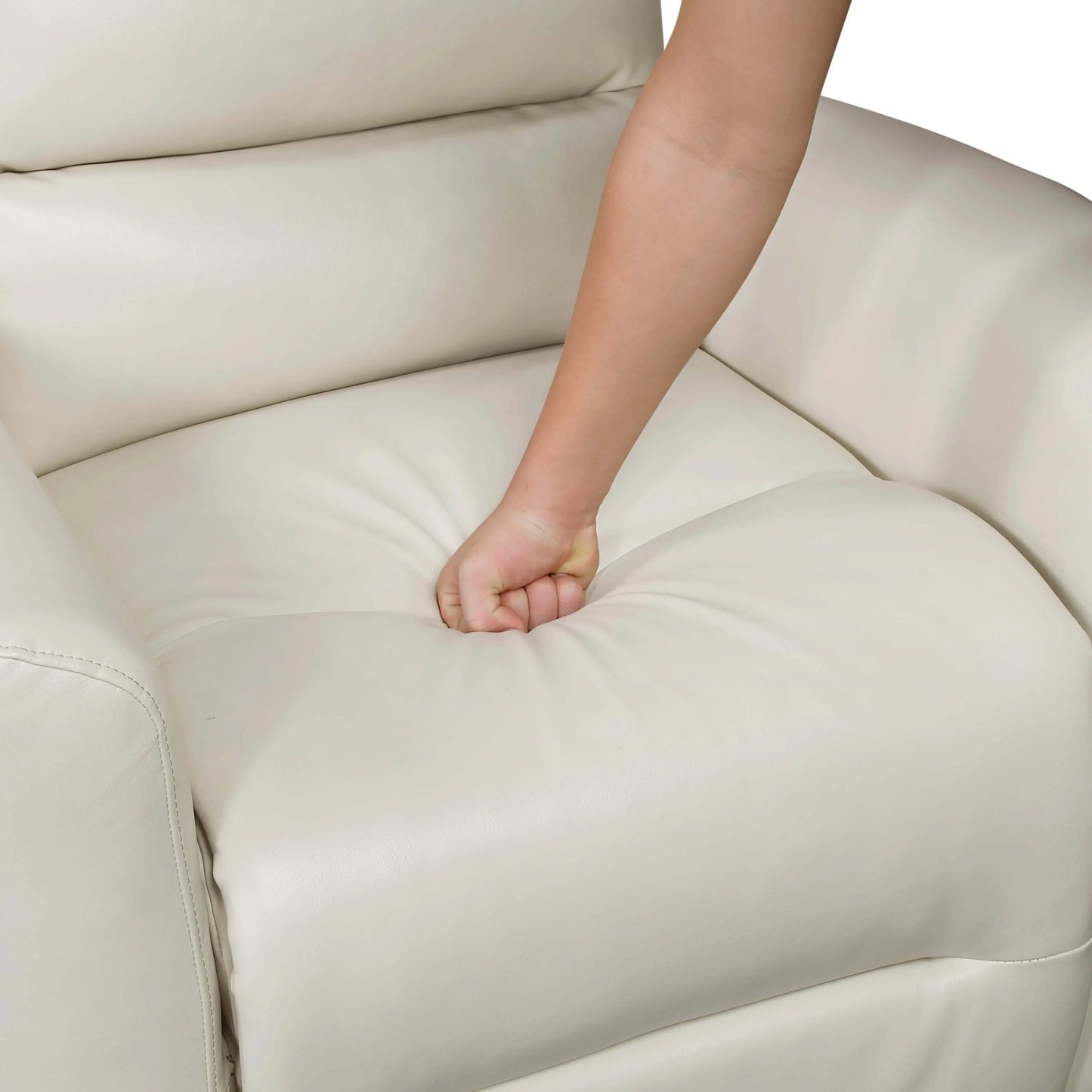 Person's hand resting on a beige recliner chair seat cushion