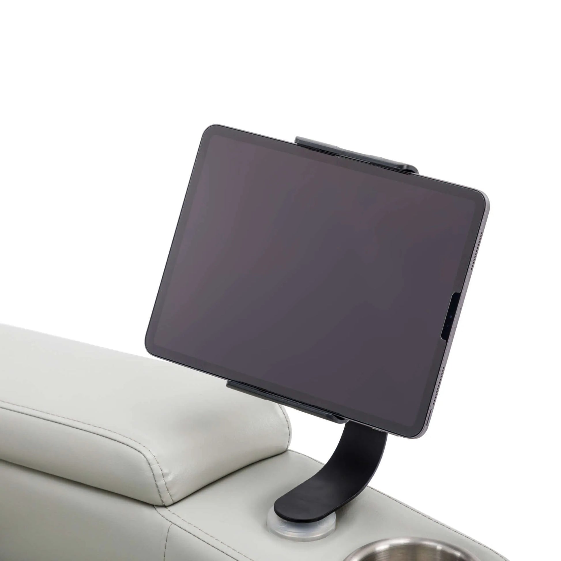 Tablet holder with tablet on a gray recliner chair with a white background