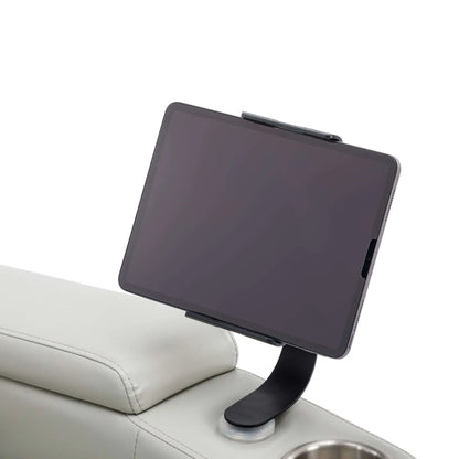 Tablet holder with tablet on a gray recliner chair with a white background