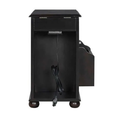 Back side of a dark brown end table with a drawer and power cord on a white background