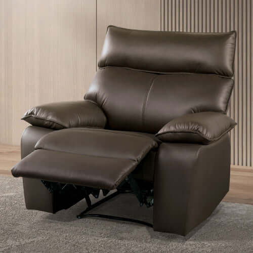Brown faux leather recliner chair in a room with wooden flooring and striped wallpaper.