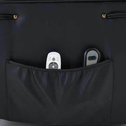 Black recliner chair storage pocket with  containing remote controls on a dark background