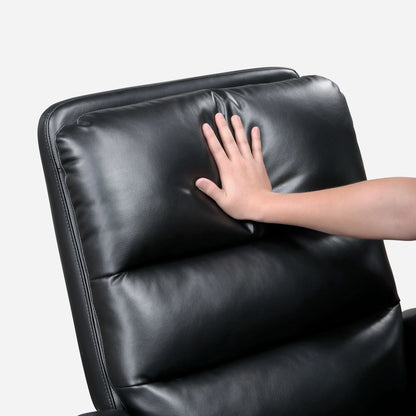 Hand touching a black leather recliner chair on a white background