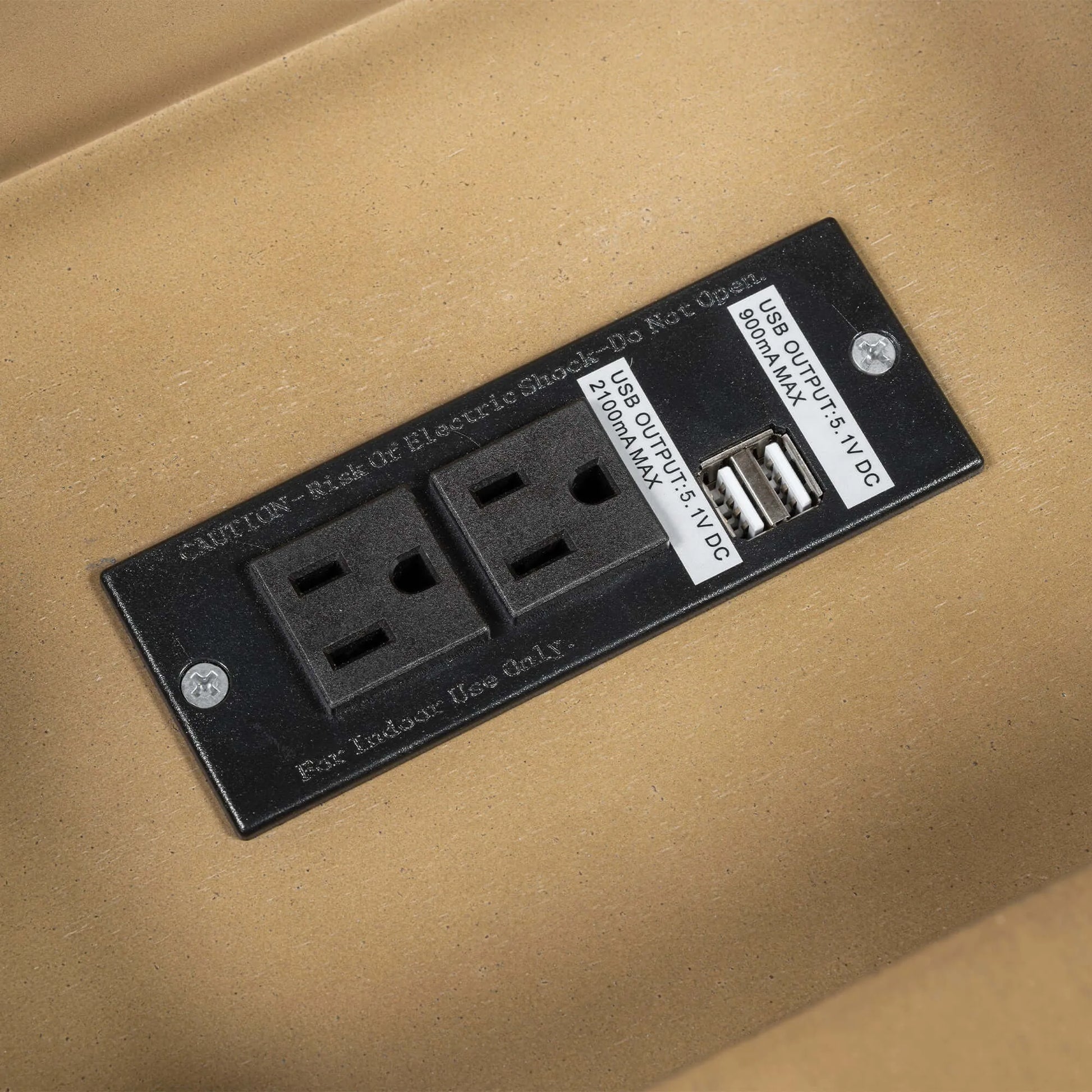 Electrical outlet panel with two sockets and a USB port on a beige background
