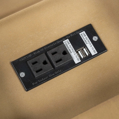 Electrical outlet panel with two sockets and a USB port on a beige background