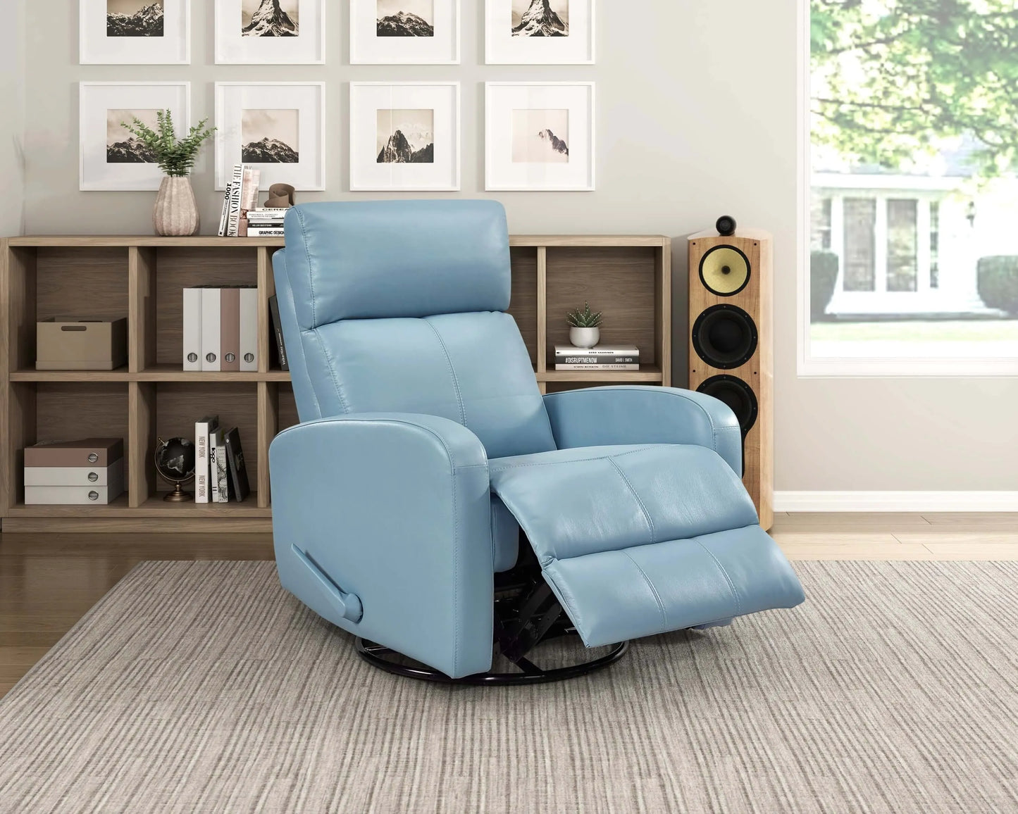 Blue recliner chair in a living room setting with bookshelf and window.