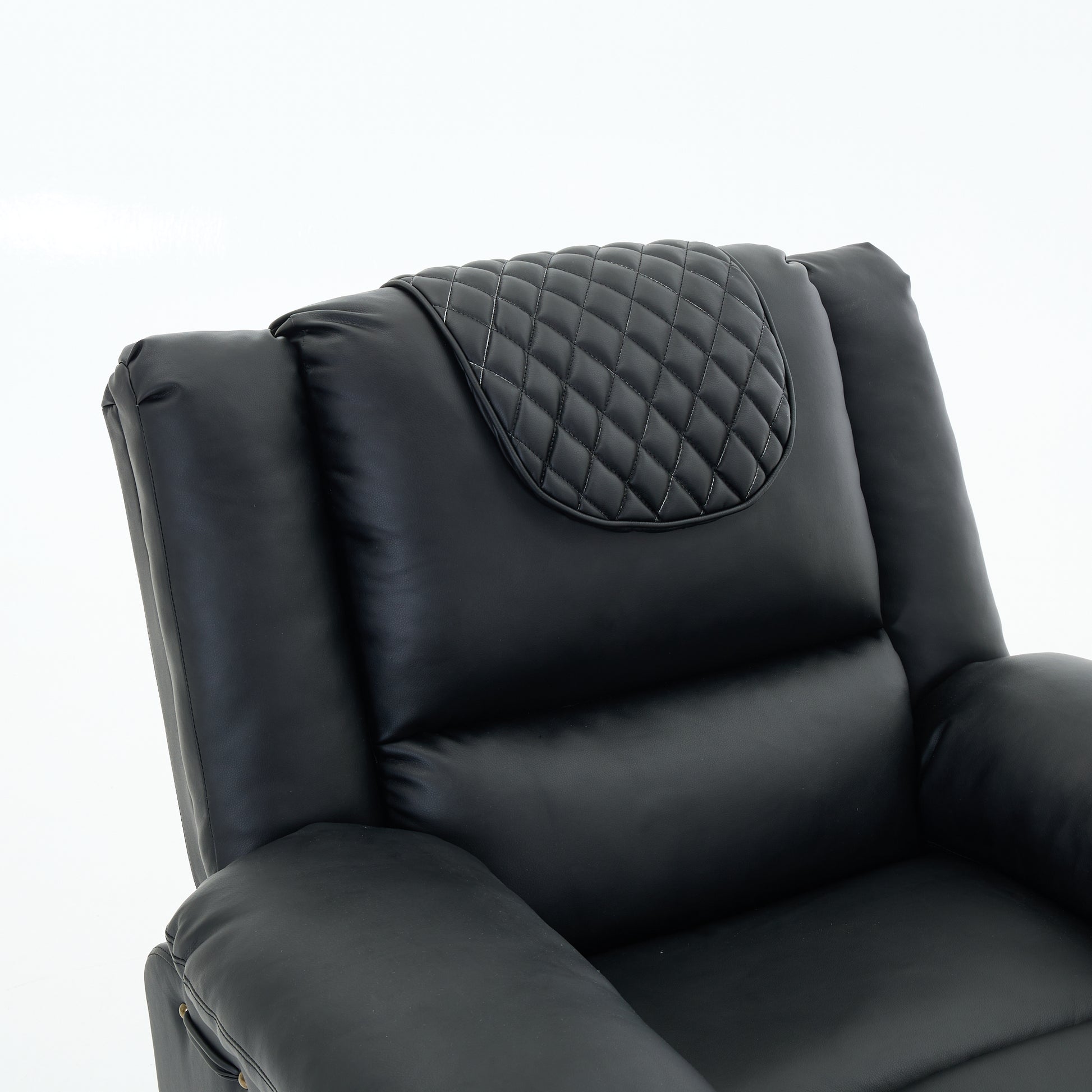 Close up of a black leather recliner chair quilted backrest on a white background