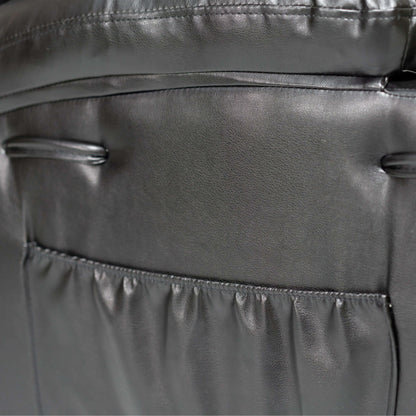 Close-up of a storage pocket with stitching details on a black faux leather power lift recliner chair