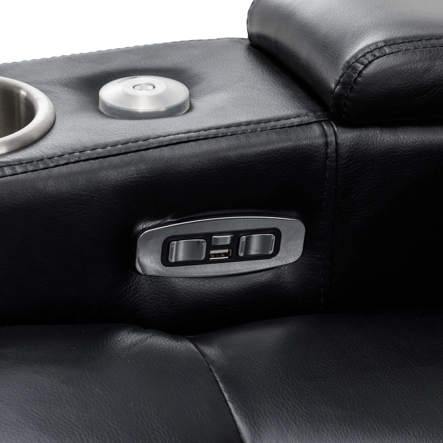 Close-up of a black leather recliner chair with cup holder and control panel.