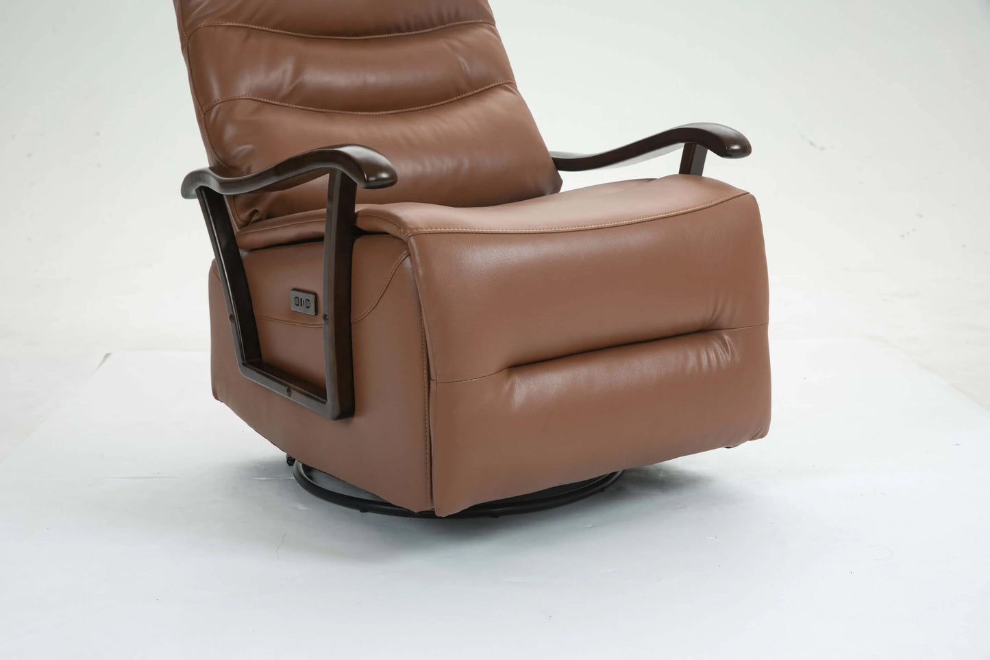 Close up of a brown leather recliner chair footrest on a white background