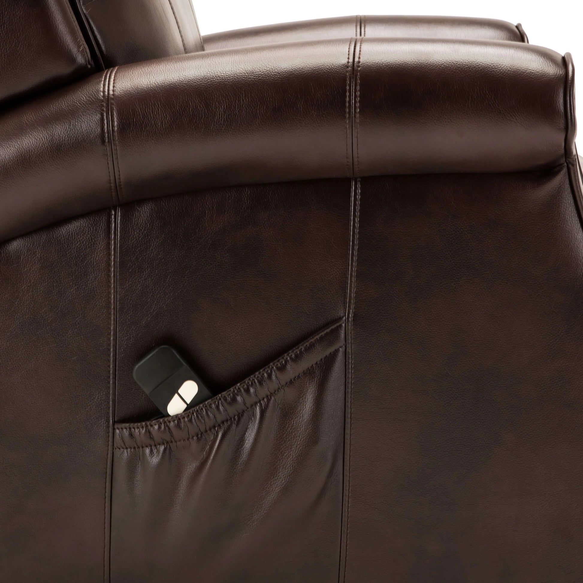 Close-up of a brown leather recliner with a pocket.