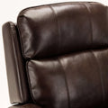 Close-up of a brown leather armchair on a white background