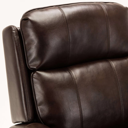 Close-up of a brown leather armchair on a white background