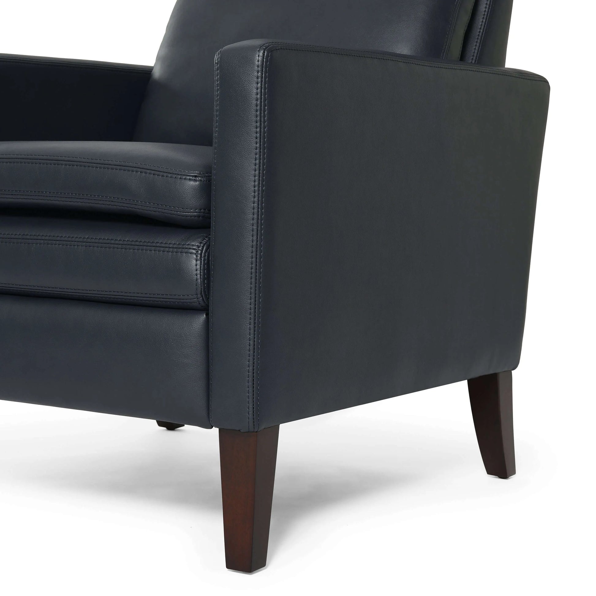 Close-up of a blue leather recliner chair armrest with wooden legs on a white background