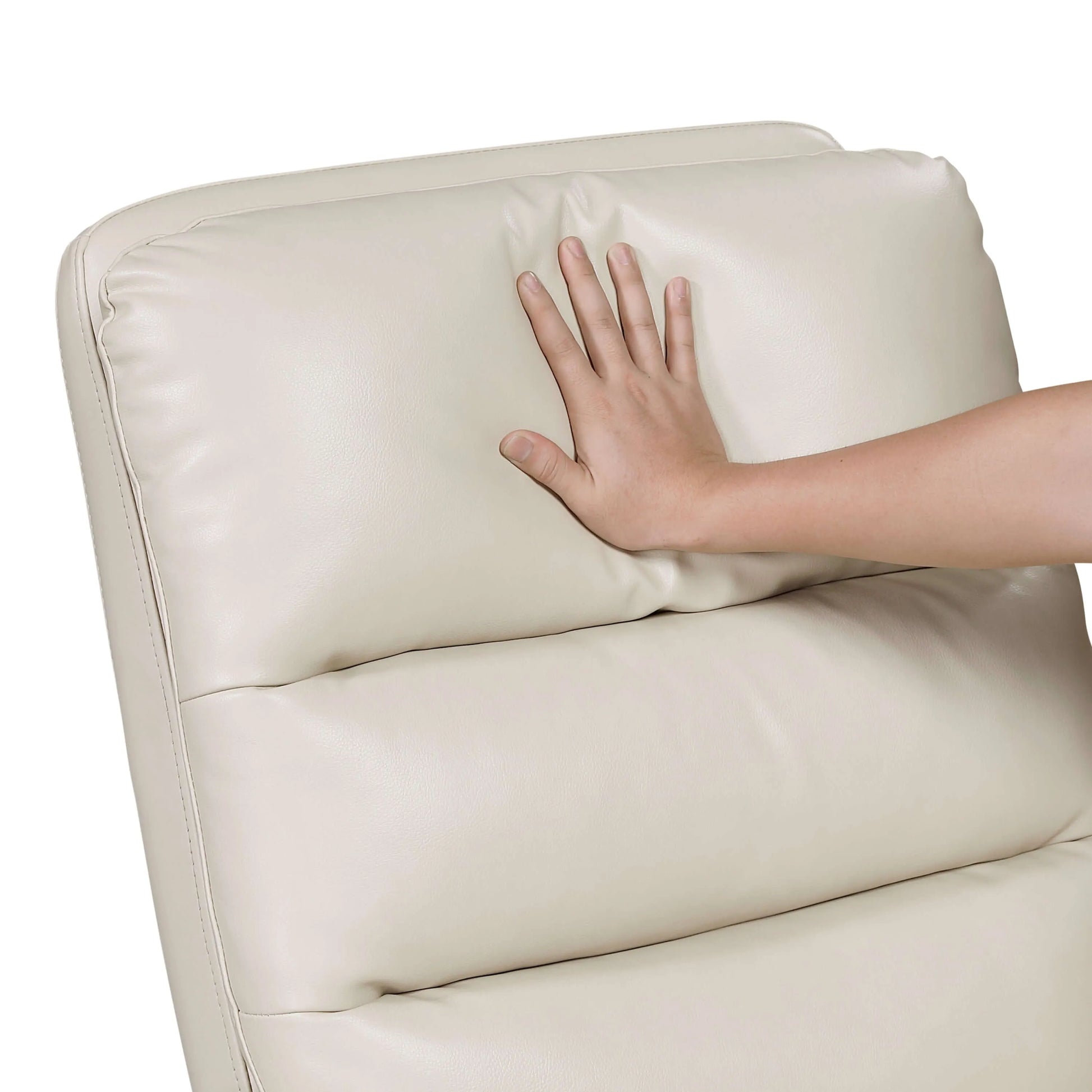 Hand touching a beige leather recliner chair cushion on a white background