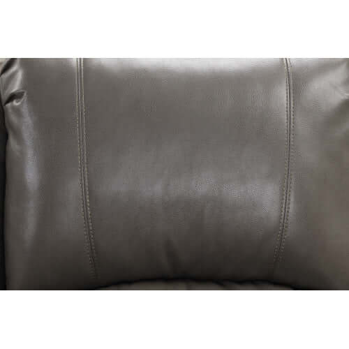 Close-up of a gray faux leather recliner chair cushion.