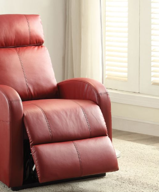Red leather recliner chair with footrest extended in a room with light-colored walls and carpet.