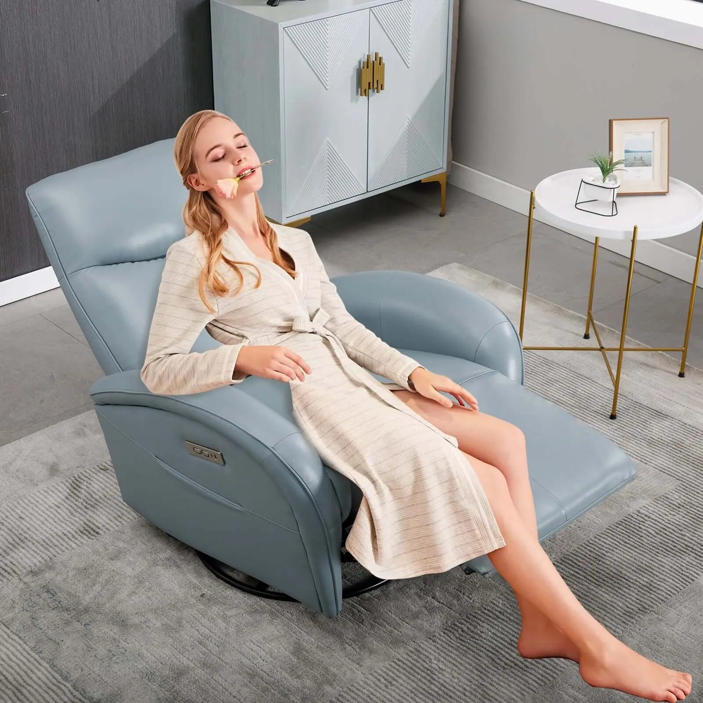 Woman relaxing in a blue recliner chair in a modern living room.