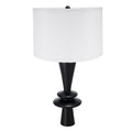 Table lamp with black base and white shade on a white background