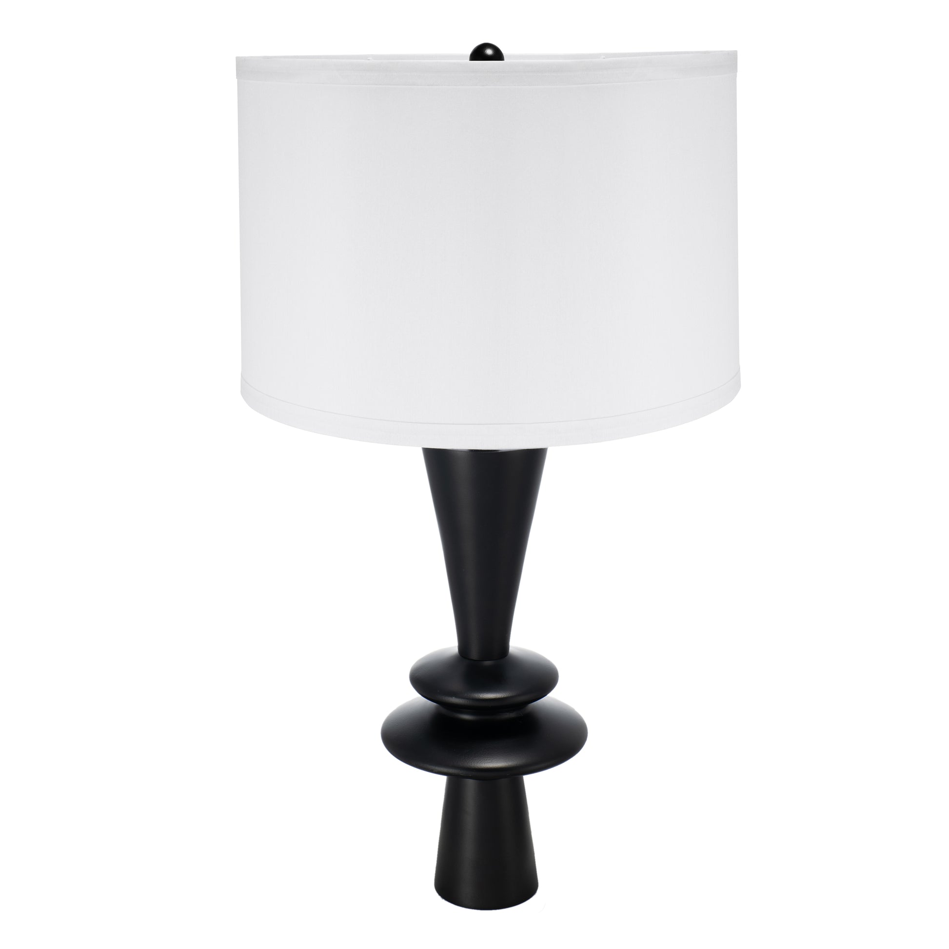 Table lamp with black base and white shade on a white background