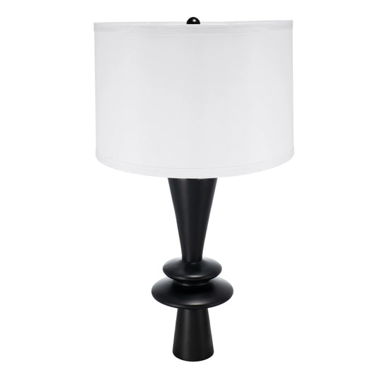 Table lamp with black base and white shade on a white background