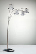 Arc floor lamp with crystal-like shades on a neutral background